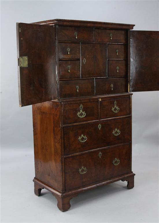 An early 18th century crossbanded cabinet on chest, W.3ft D.1ft 9in. H.5ft 6in.